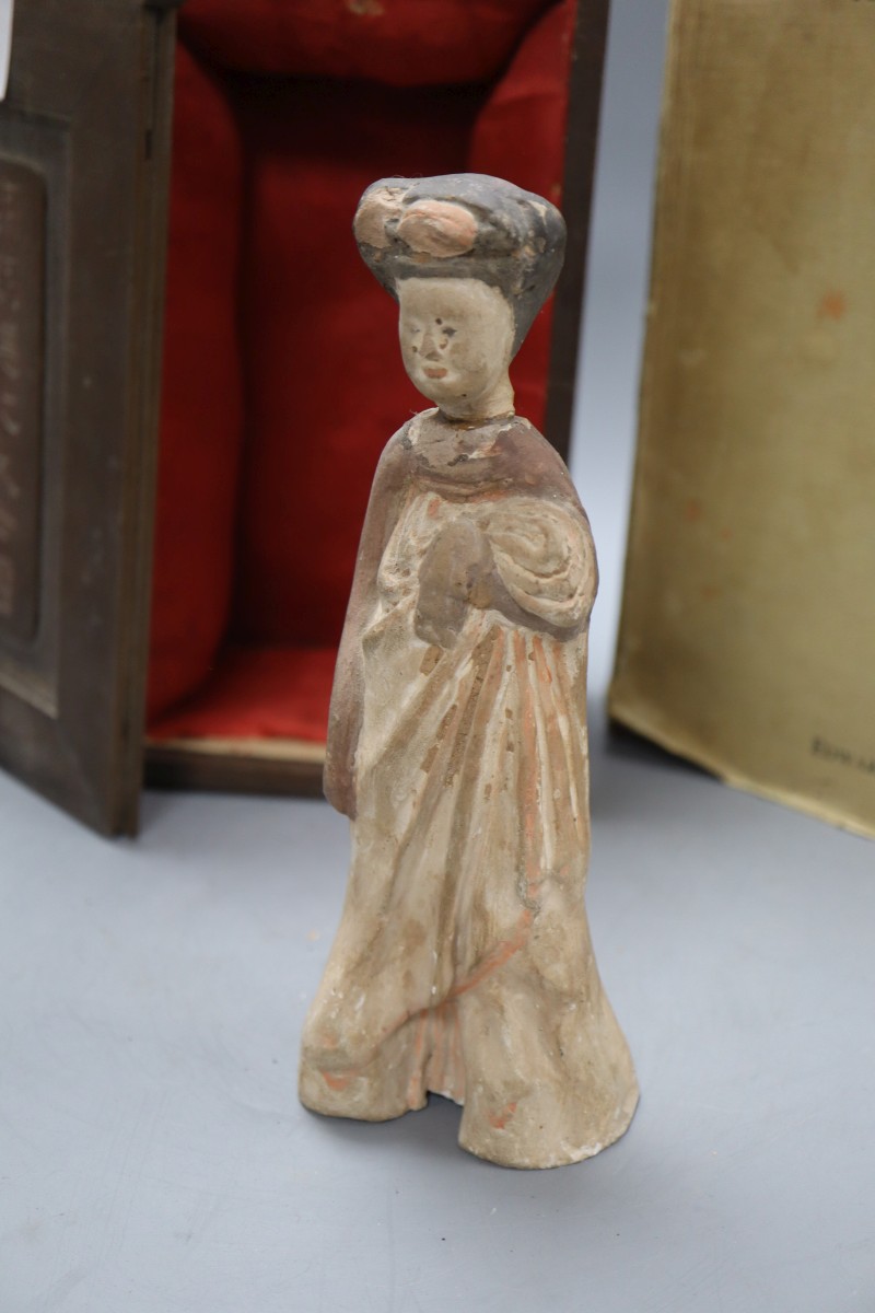 A Tang terracotta figure of a lady (a.f.) and Hentze, C. - A study in the beliefs of folklore of ancient China and a boxed Chinese tomb